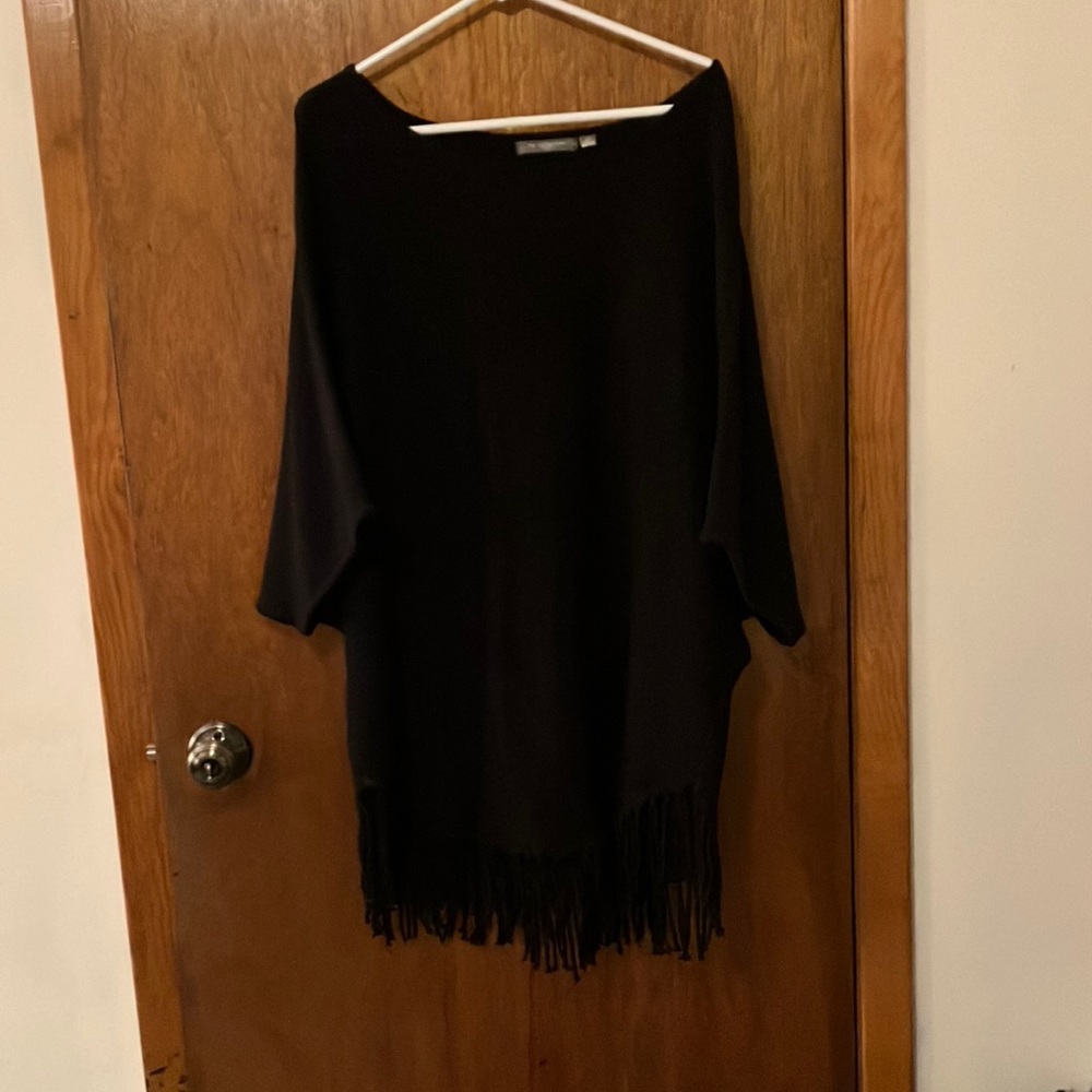 Black -over the head -poncho with fringe at the bottom